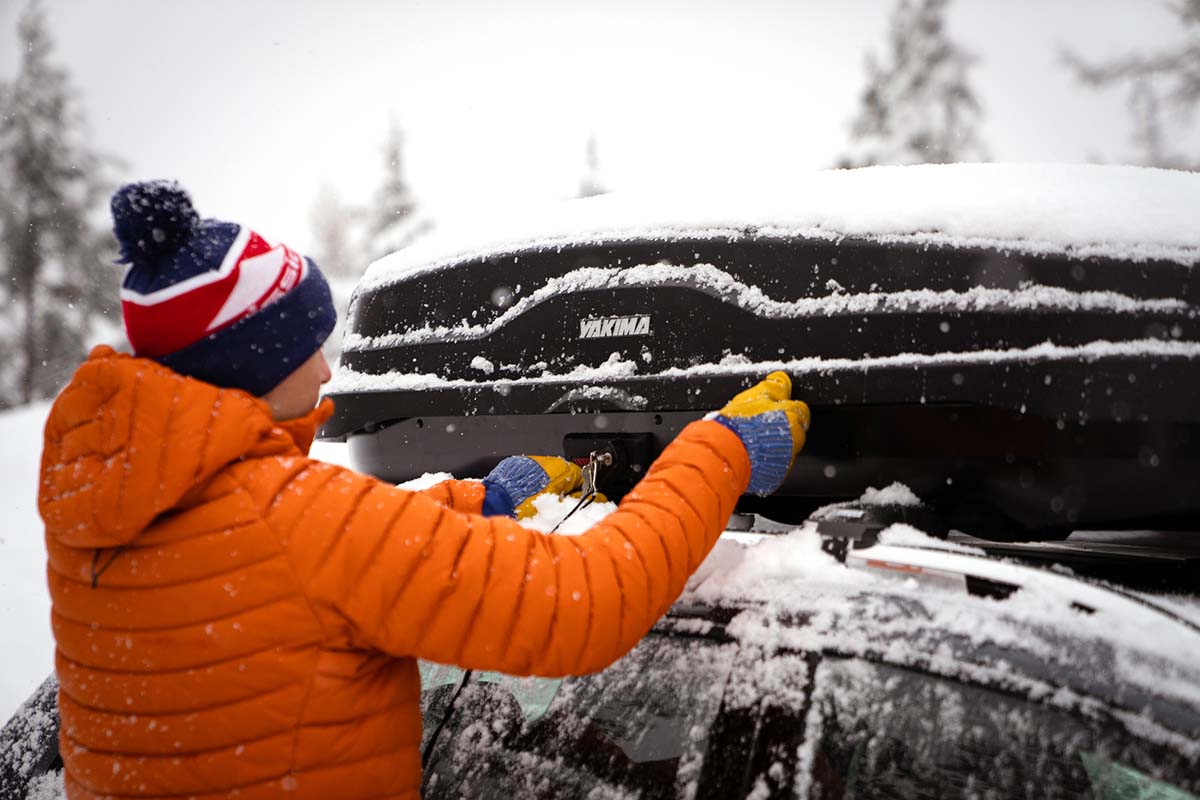 Opening cargo box (wearing winter down jacket)